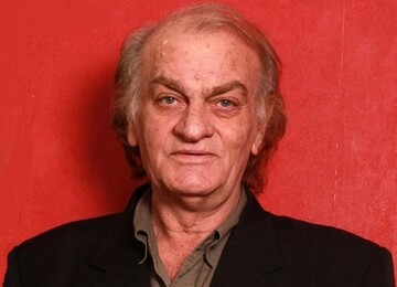 فتحعلی اویسی در ۴۰ سالگی در کنار پسرش در گیلان؛ سال ۱۳۶۴/ عکس